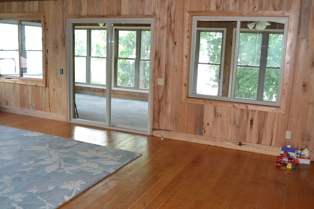 375 Flintside Dr, Cobb, GA 31735 - entryway featuring wood-type flooring, wooden walls, and baseboards