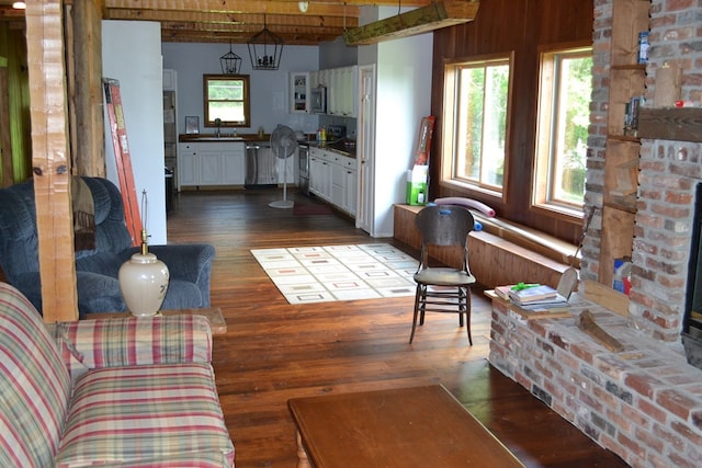 375 Flintside Dr, Cobb, GA 31735 - living room with dark wood-style floors and beamed ceiling