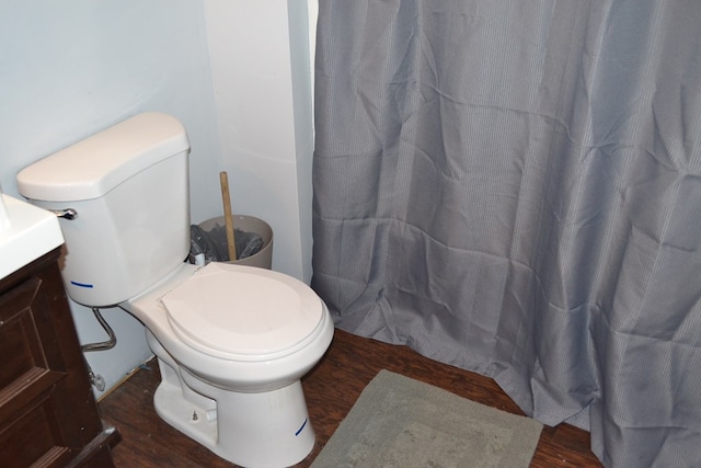 375 Flintside Dr, Cobb, GA 31735 - full bath with toilet, wood finished floors, vanity, and curtained shower