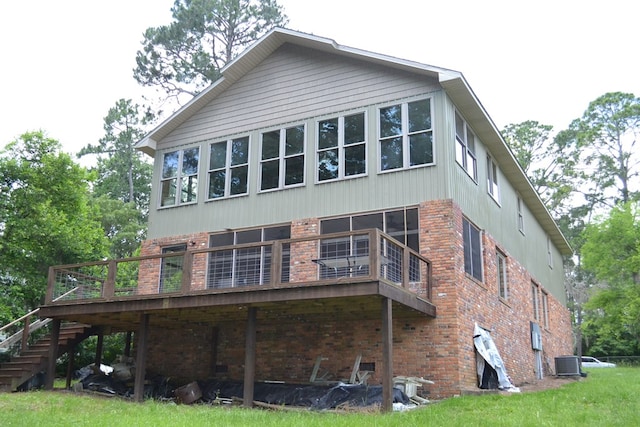 375 Flintside Dr, Cobb, GA 31735 - back of property featuring brick siding, stairs, central AC, and a deck