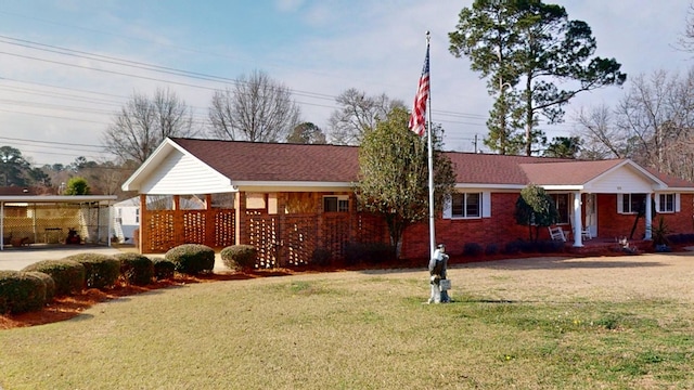 single story home with a carport and a front lawn