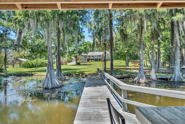 115 N Cedar Creek Rd, Cordele, GA 31015 - dock featuring a yard, view of scattered trees, and a water view