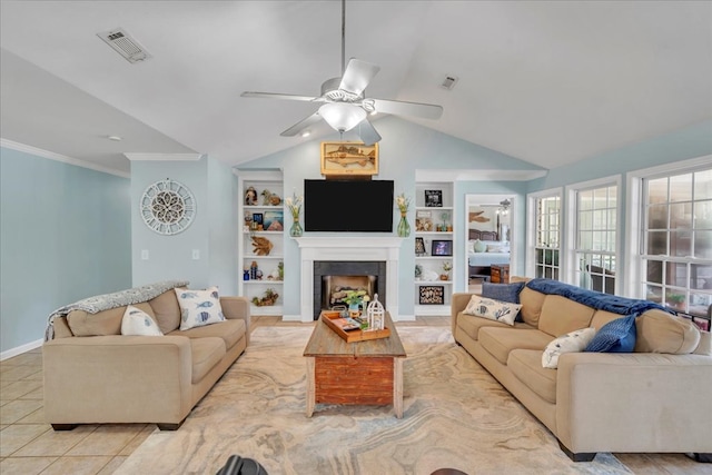115 N Cedar Creek Rd, Cordele, GA 31015 - living room with ceiling fan, vaulted ceiling, built in features, light tile patterned floors, and a tile fireplace