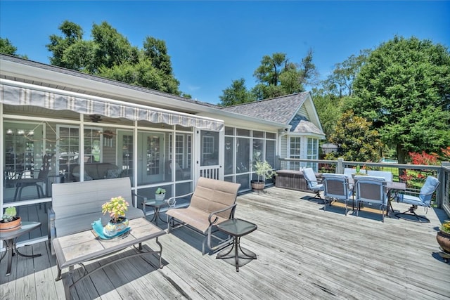 115 N Cedar Creek Rd, Cordele, GA 31015 - wooden deck featuring outdoor dining area, a sunroom, and ceiling fan