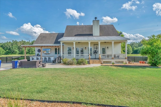 1942 Antioch Rd, Cordele, GA 31015 - back of house featuring ceiling fan, a chimney, and covered porch