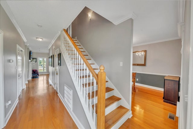 1942 Antioch Rd, Cordele, GA 31015 - stairs featuring wood finished floors, ornamental molding, and baseboards