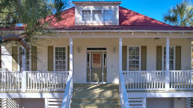 view of front of home featuring covered porch and a garage