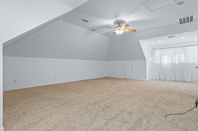 additional living space featuring ceiling fan, lofted ceiling, and carpet flooring