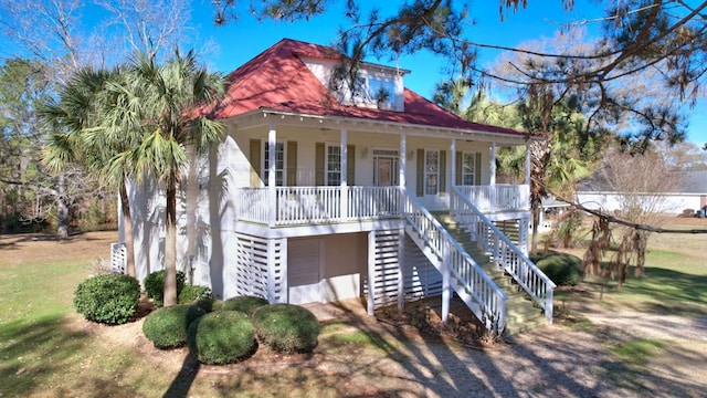 view of front of house with a porch and a garage