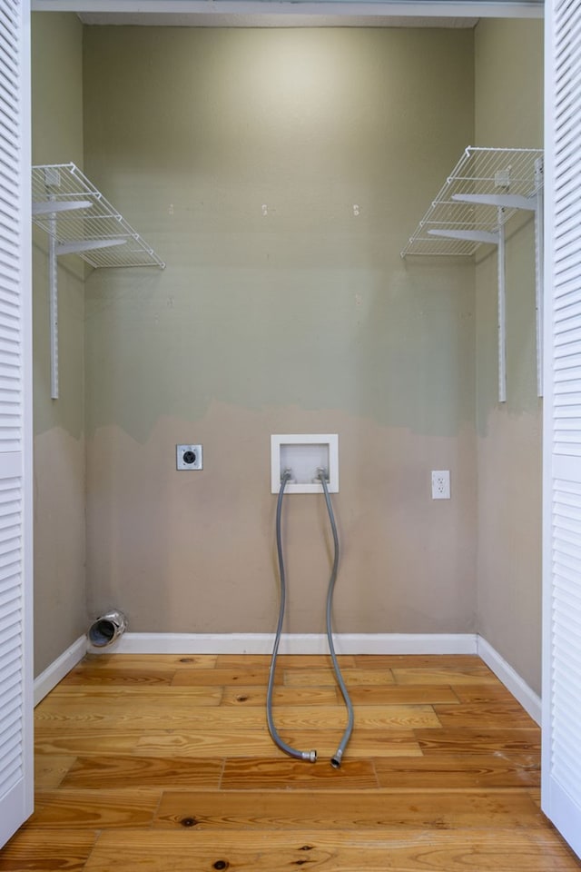 laundry room featuring washer hookup, hookup for an electric dryer, and wood-type flooring