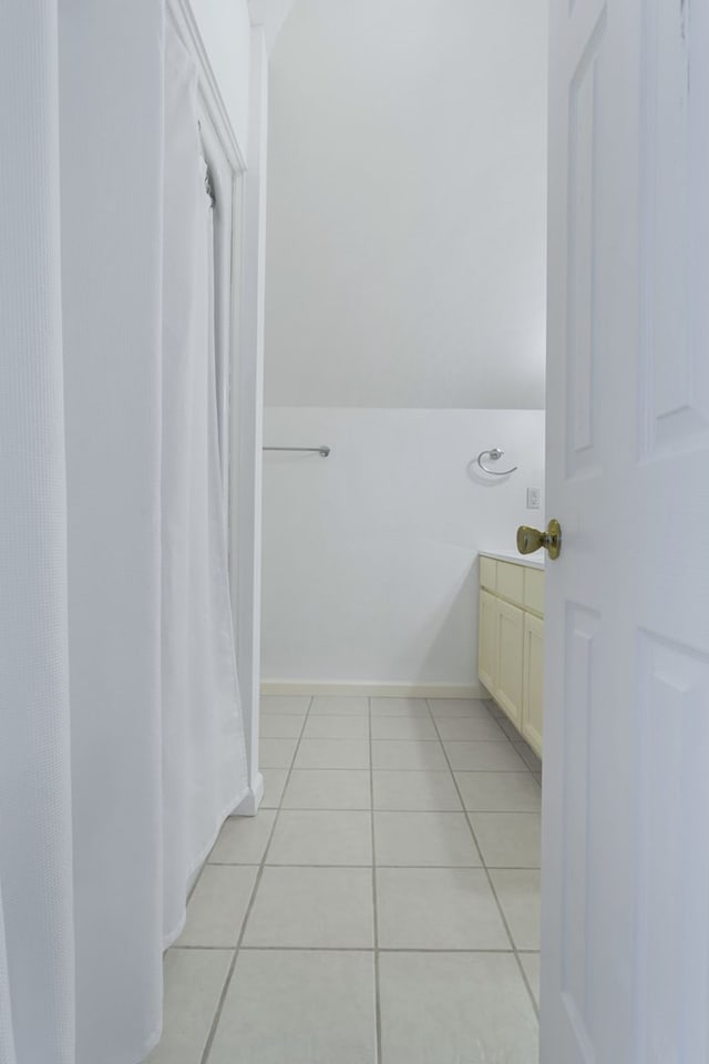 bathroom featuring tile patterned floors and vanity