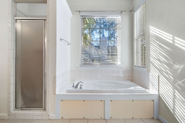 bathroom featuring tile patterned floors, radiator heating unit, and independent shower and bath