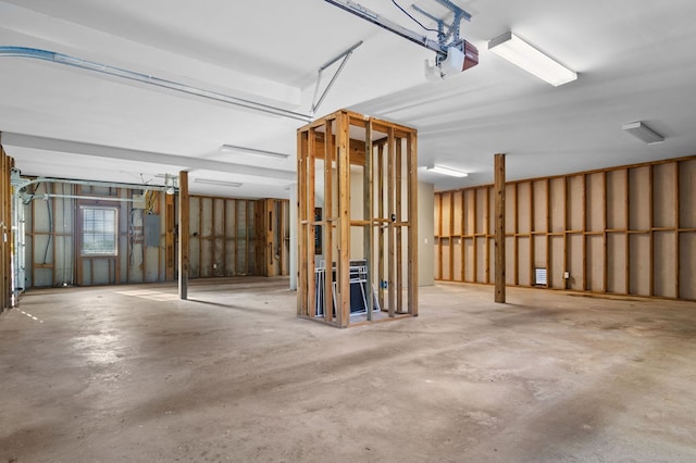 garage featuring a garage door opener and electric panel