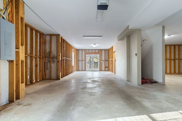 interior space with electric panel and french doors