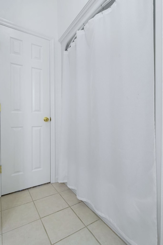 bathroom with tile patterned floors