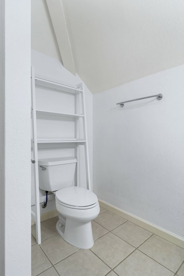 bathroom featuring tile patterned floors and toilet