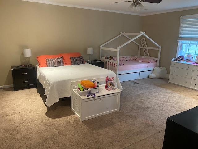 carpeted bedroom with ceiling fan and crown molding