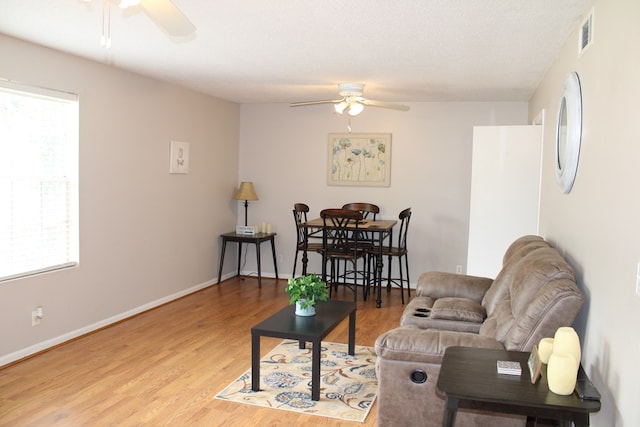 101F Country Club Dr, Americus, GA 31709 - living area with ceiling fan, wood finished floors, and baseboards