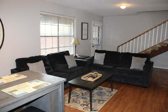 101F Country Club Dr, Americus, GA 31709 - living room with wood finished floors, stairs, and a textured ceiling