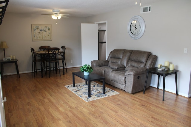 101F Country Club Dr, Americus, GA 31709 - living area with ceiling fan, wood finished floors, and baseboards