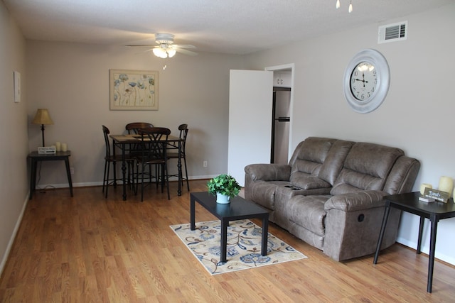 101F Country Club Dr, Americus, GA 31709 - living area with a ceiling fan, wood finished floors, and baseboards