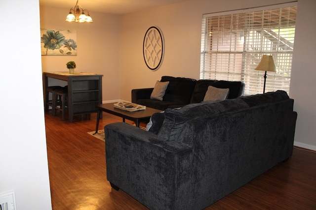101F Country Club Dr, Americus, GA 31709 - living area with wood finished floors, a chandelier, and baseboards