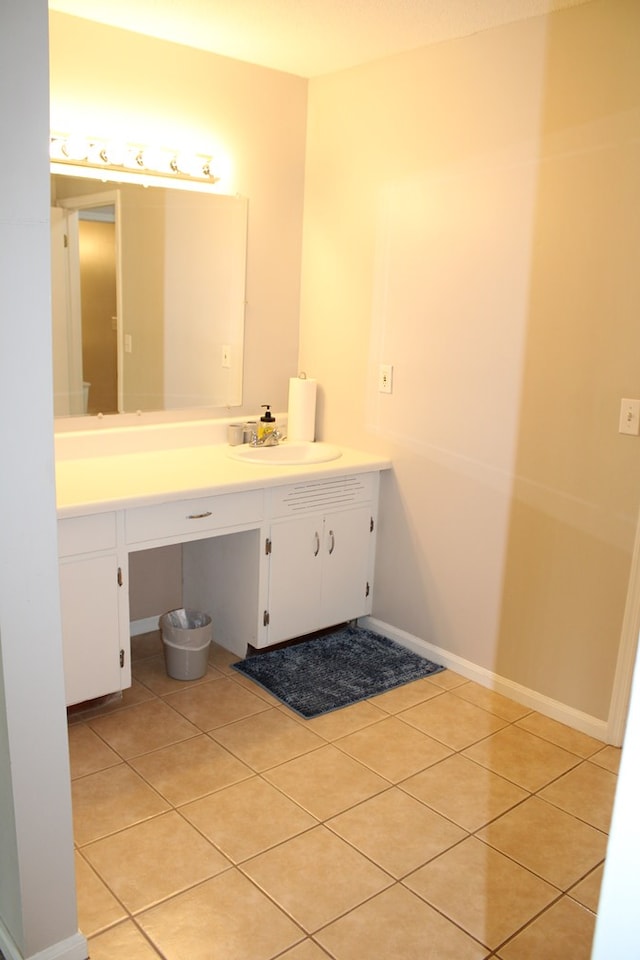 101F Country Club Dr, Americus, GA 31709 - bathroom with tile patterned flooring, vanity, and baseboards