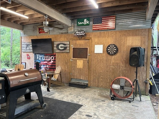 169 Wanda Rd, Cordele, GA 31015 - recreation room with a ceiling fan and wooden walls