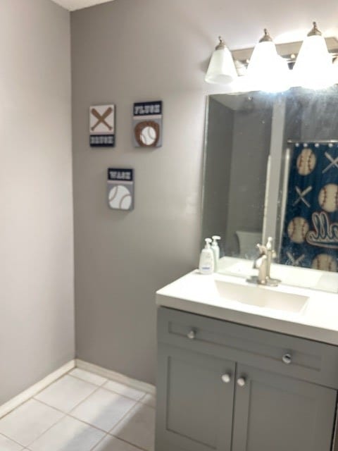 169 Wanda Rd, Cordele, GA 31015 - bathroom with vanity, baseboards, and tile patterned flooring
