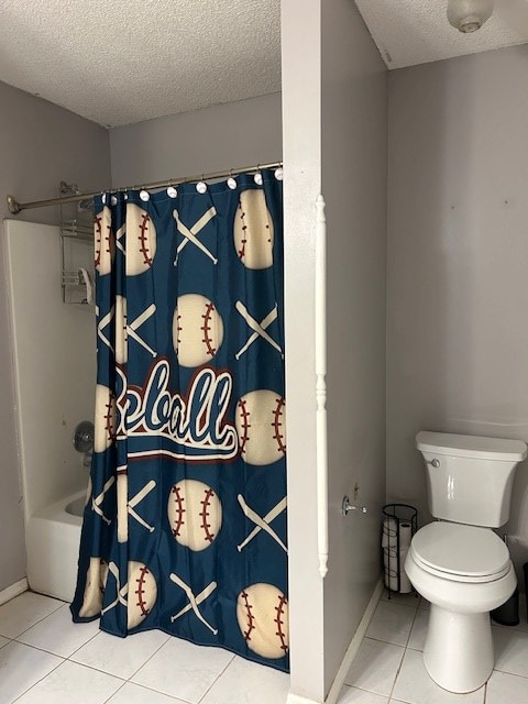 169 Wanda Rd, Cordele, GA 31015 - full bath with a textured ceiling, tile patterned flooring, toilet, baseboards, and shower / bath combo