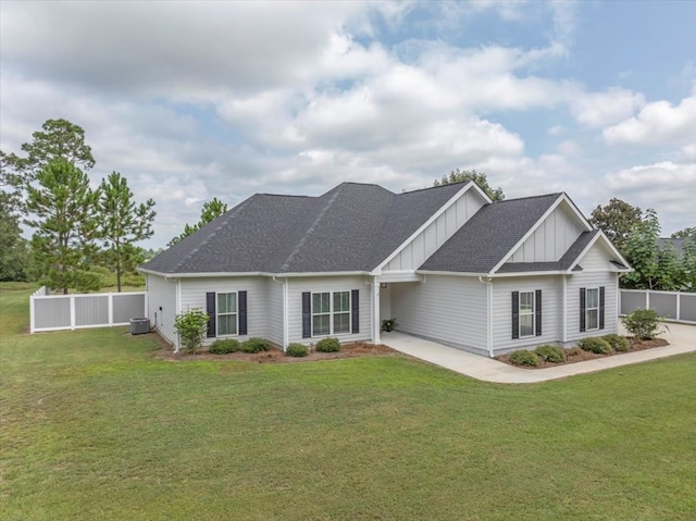 view of front facade featuring central AC and a front lawn