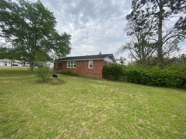 view of property exterior featuring a yard