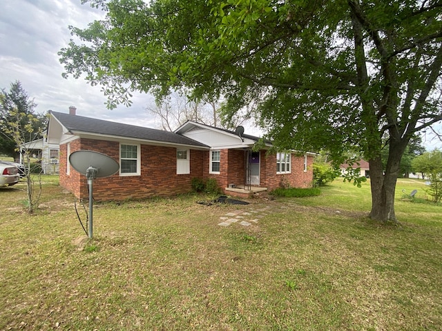 ranch-style home with a front yard