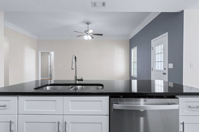 kitchen with sink, stainless steel dishwasher, and white cabinetry