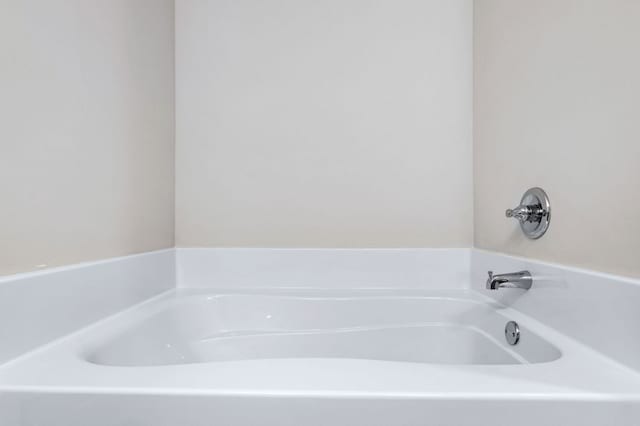 bathroom with a washtub