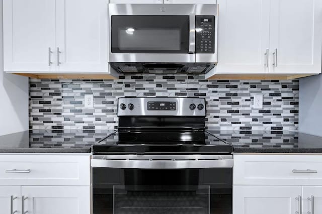 kitchen featuring white cabinetry, backsplash, and appliances with stainless steel finishes