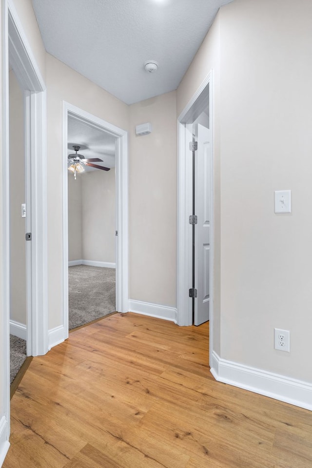 hallway featuring light wood-type flooring