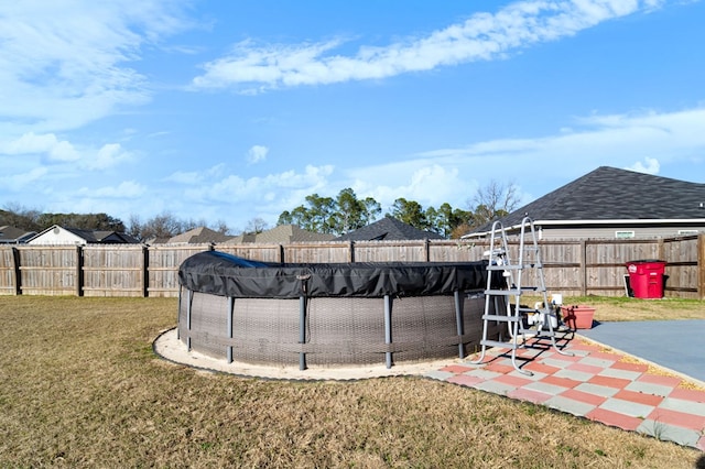 view of yard featuring a covered pool