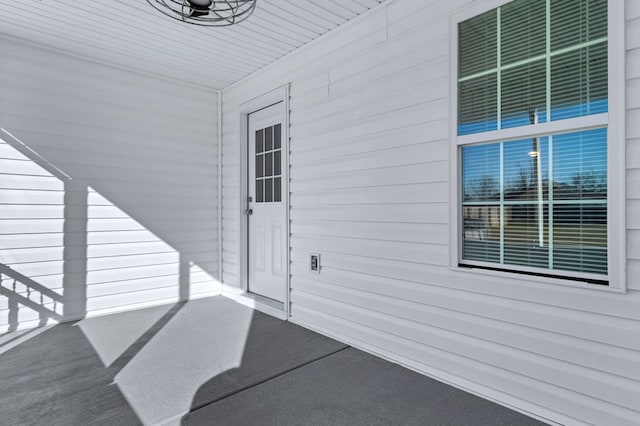 entrance to property featuring ceiling fan