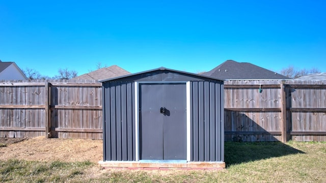 view of outbuilding featuring a lawn