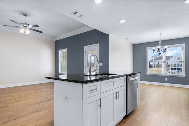 kitchen with sink, white cabinets, light hardwood / wood-style flooring, and dishwasher