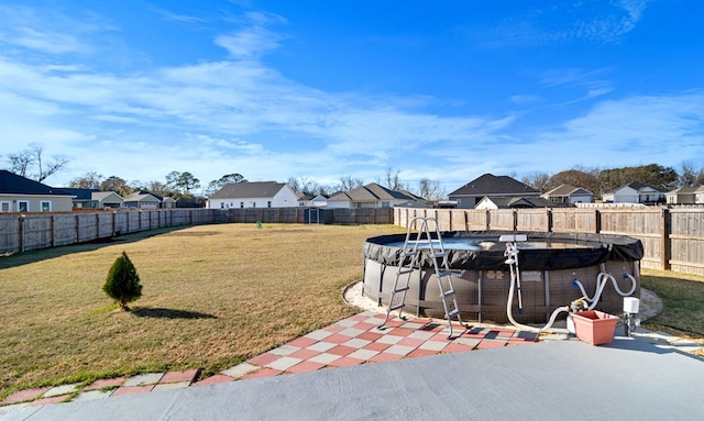 view of yard with a fenced in pool