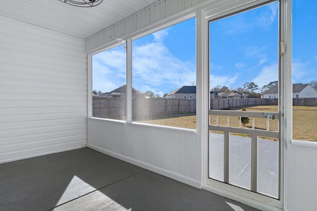 unfurnished sunroom with a healthy amount of sunlight