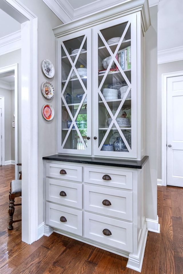 interior details featuring hardwood / wood-style floors and ornamental molding