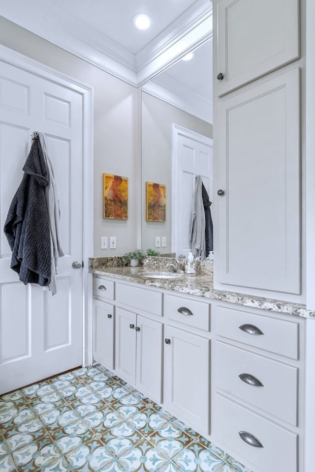 bathroom featuring vanity and crown molding