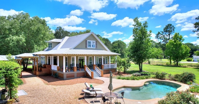 back of property featuring a lawn and a patio area