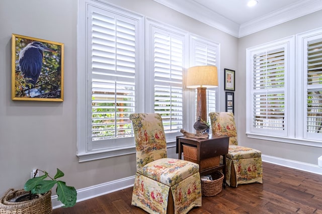 living area with ornamental molding and dark wood-type flooring