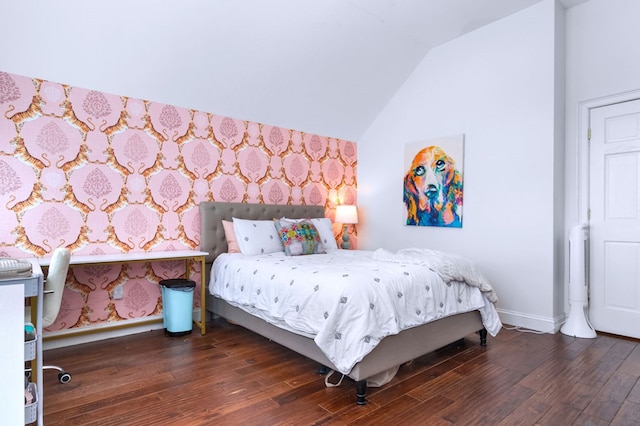 bedroom featuring vaulted ceiling and dark hardwood / wood-style floors