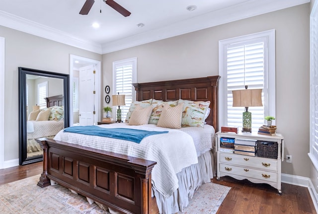 bedroom with ceiling fan, ornamental molding, and dark hardwood / wood-style flooring