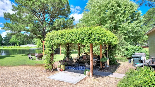 view of yard with outdoor lounge area and a water view